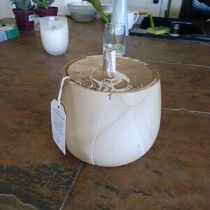 Tan and white lidded jar